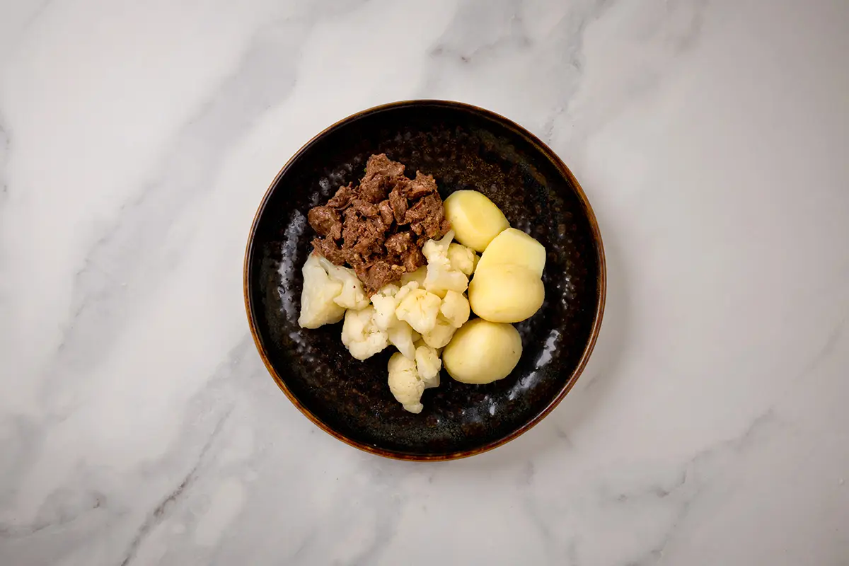 Aardappelen met bloemkool en draadjesvlees van De Vitaminebron